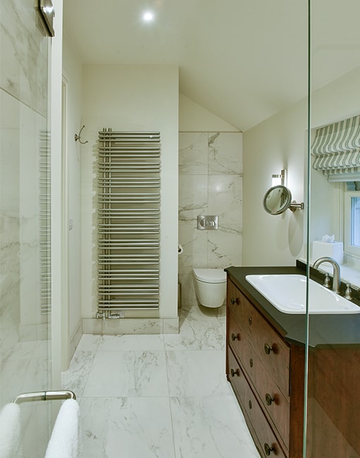 5 Upcycled vanity in white marble bathroom