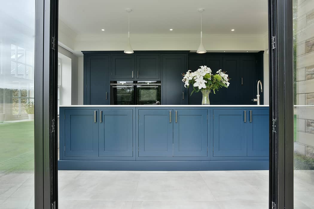8. Blue Cabinetry with Complementry Soft Neutral Backdrop resized